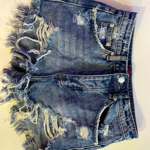 Medium wash distressed denim shorts small (27)